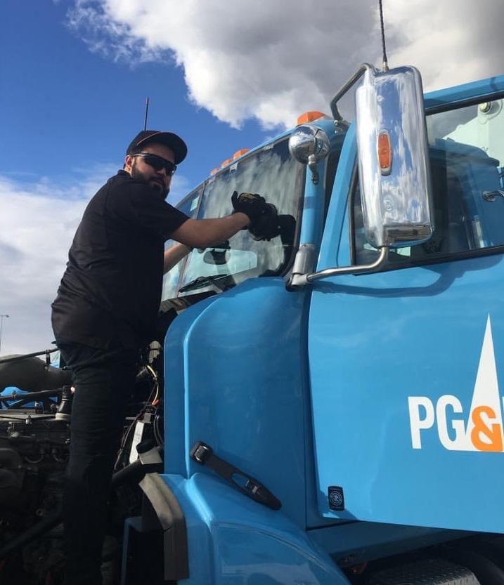 Auto Glass Force technician working on a truck